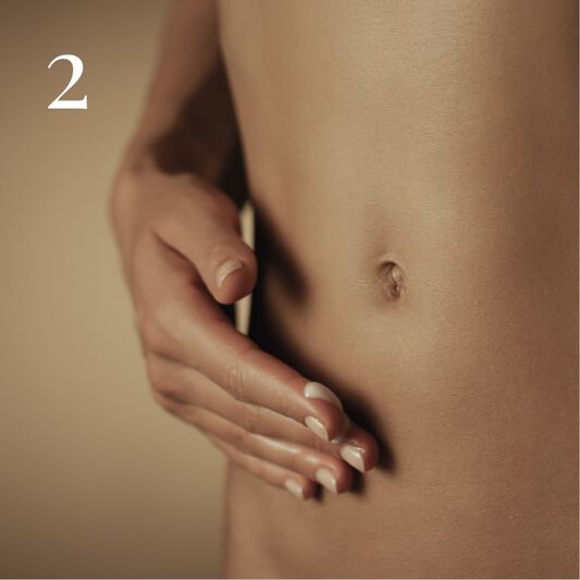 Application and massage of the contouring body care on the stomach and waist
