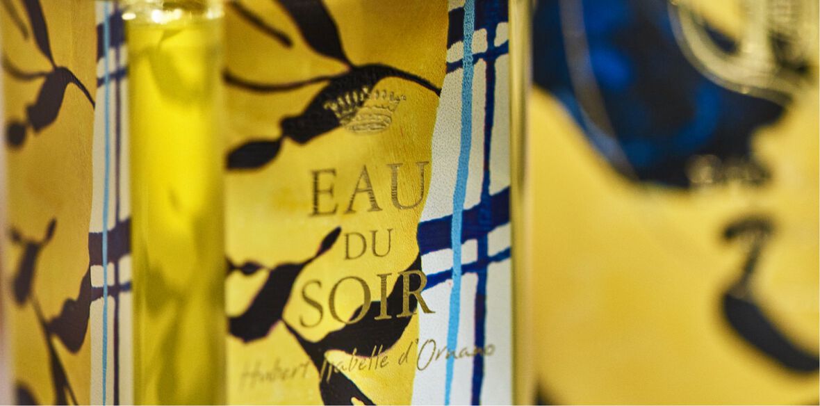 Details of the Eau du Soir limited-edition fragrance bottle with “One Day Painting 2" by Ymane Chabi-Gara