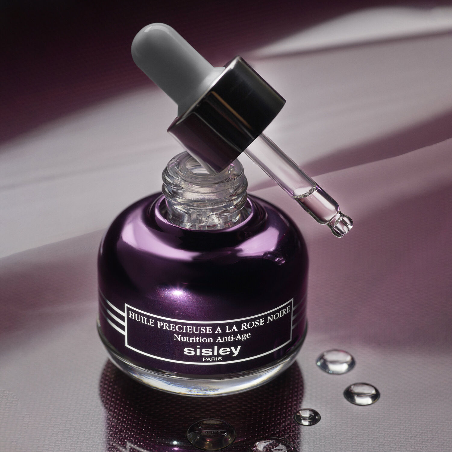 Sisley Black Rose Precious Face Oil 25ml bottle on an elegant background. Illuminating anti-aging facial oil. - thumbnail 2