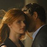 Man breathing in Hair Rituel by Sisley Le Parfum on a woman&rsquo;s neck