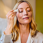 Model massaging their face 